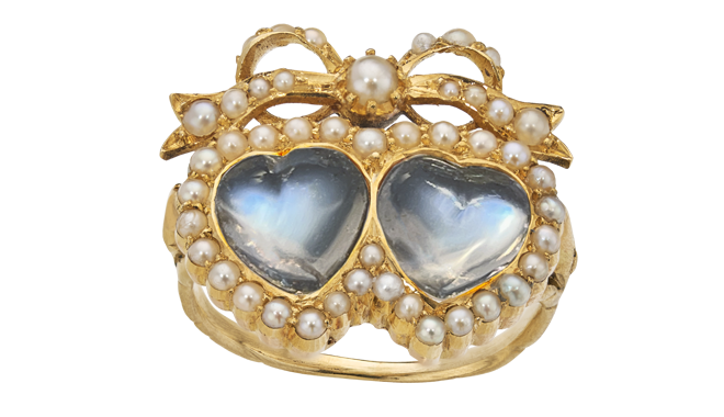 C19th.<br>Gold.<br>A Twin Hearts with Lover's Knot Ring<br>set with Moonstones & Split Pearls
